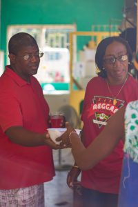 Bowl of food being handed out