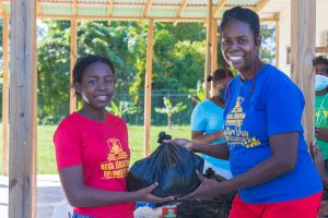 Care package being handed to young girl