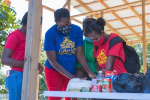 Two ladies writing on table